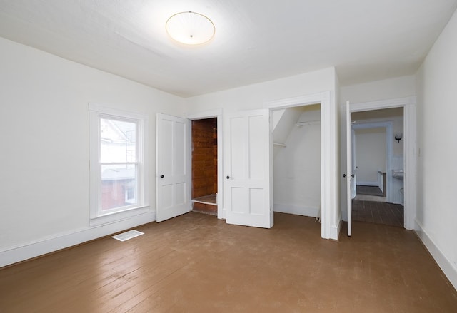 unfurnished bedroom with hardwood / wood-style flooring