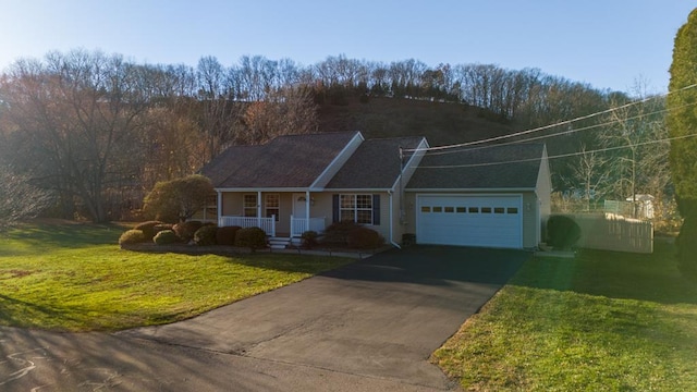 ranch-style home featuring a porch, a garage, driveway, and a front lawn