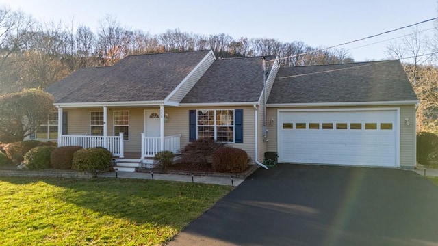 single story home featuring aphalt driveway, roof with shingles, a porch, an attached garage, and a front yard