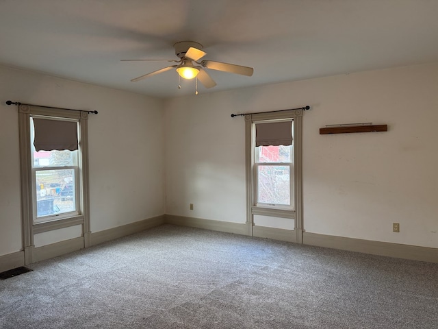 carpeted empty room with ceiling fan