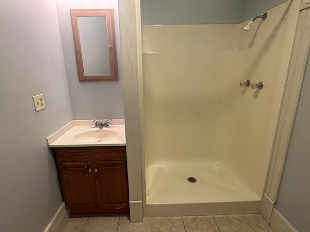 bathroom with vanity, tile patterned floors, and walk in shower