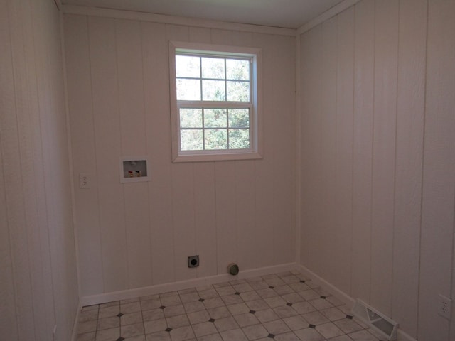 washroom with hookup for a washing machine, crown molding, and electric dryer hookup