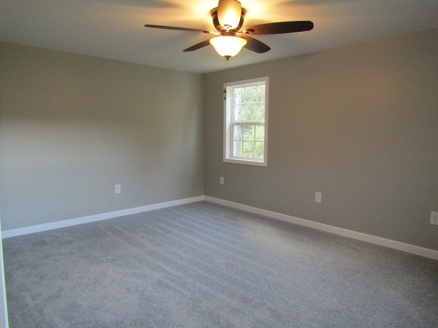 empty room featuring carpet and ceiling fan