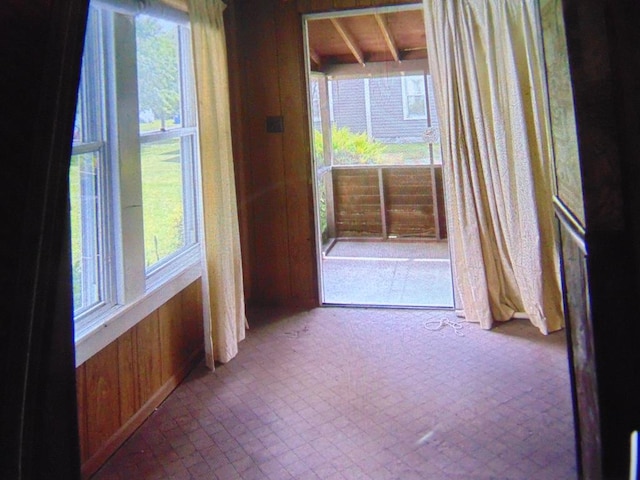 208 Tyler St, Athens, PA 18810 - hallway with wooden walls and plenty of natural light