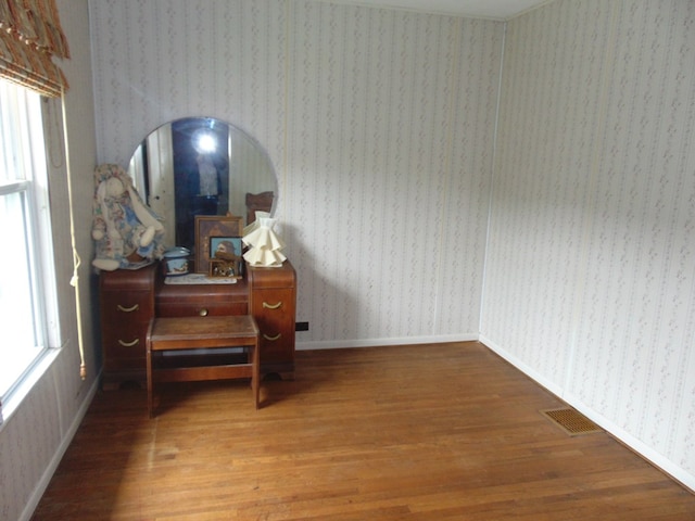 208 Tyler St, Athens, PA 18810 - bedroom with wood finished floors, baseboards, and wallpapered walls