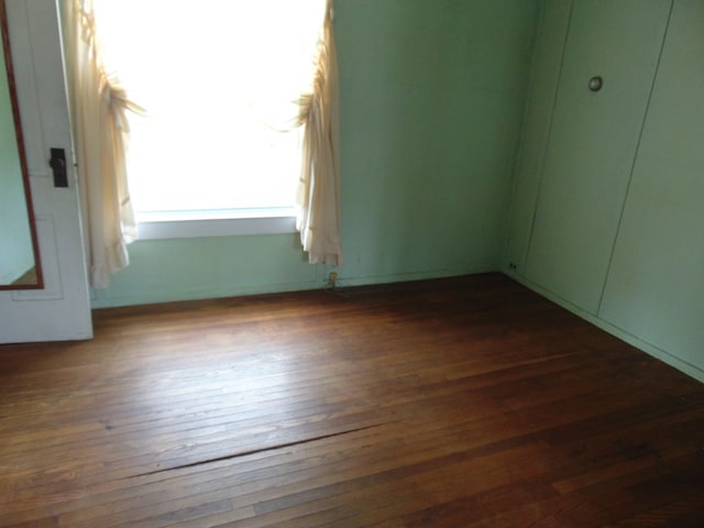208 Tyler St, Athens, PA 18810 - unfurnished bedroom featuring dark wood-style flooring