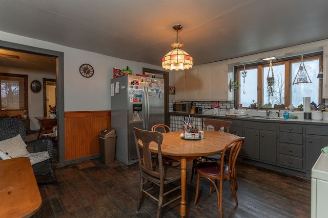 dining room with dark hardwood / wood-style flooring and sink