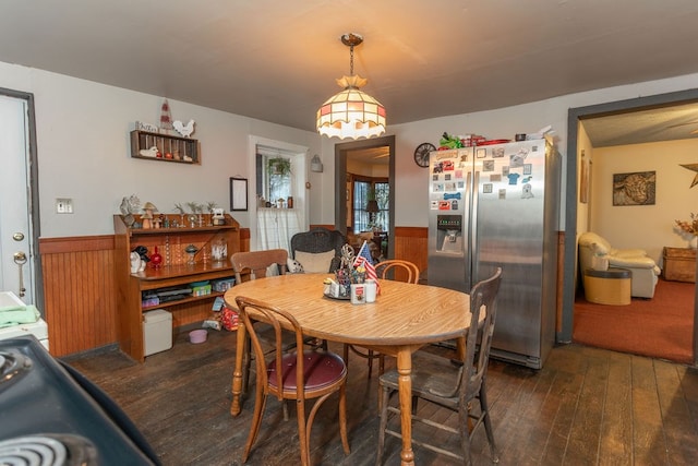 dining space with dark hardwood / wood-style floors