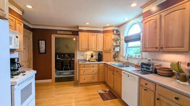 kitchen featuring light wood-type flooring, backsplash, white appliances, crown molding, and sink