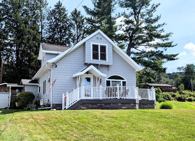 bungalow-style home with a wooden deck and a front yard