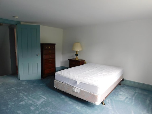 bedroom featuring dark carpet