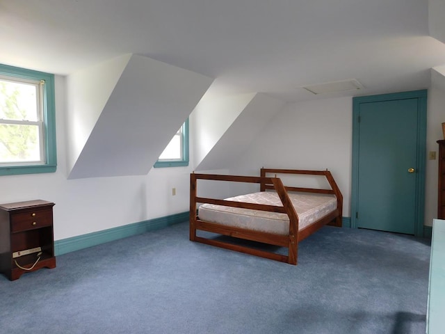 bedroom with light carpet and vaulted ceiling