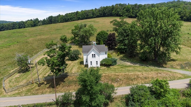 birds eye view of property with a rural view