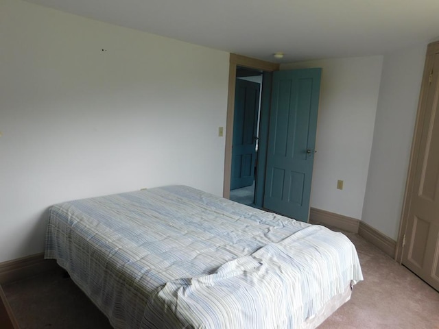 bedroom featuring light carpet