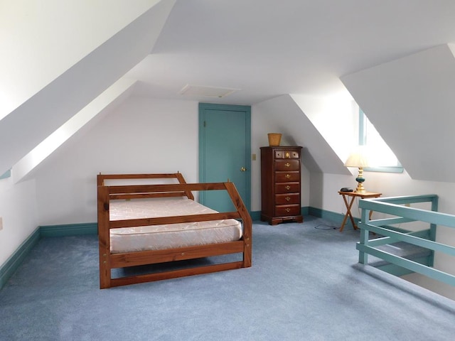 carpeted bedroom featuring vaulted ceiling