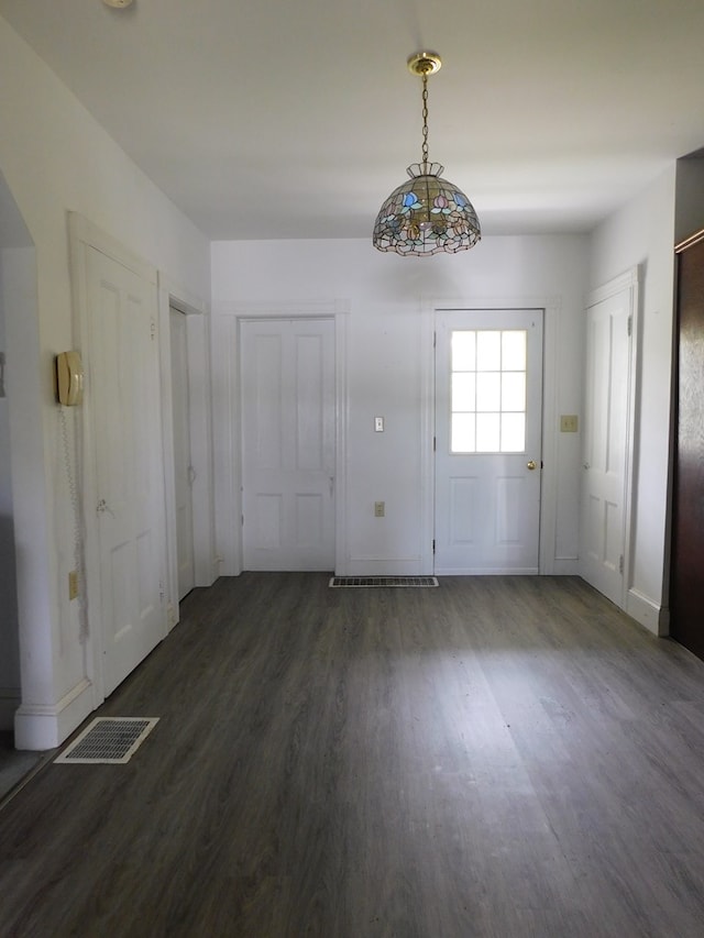 entrance foyer with dark hardwood / wood-style floors