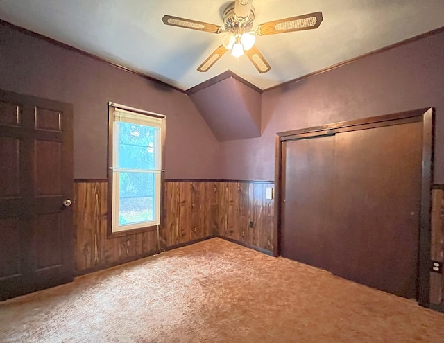 additional living space featuring ceiling fan, light carpet, and lofted ceiling