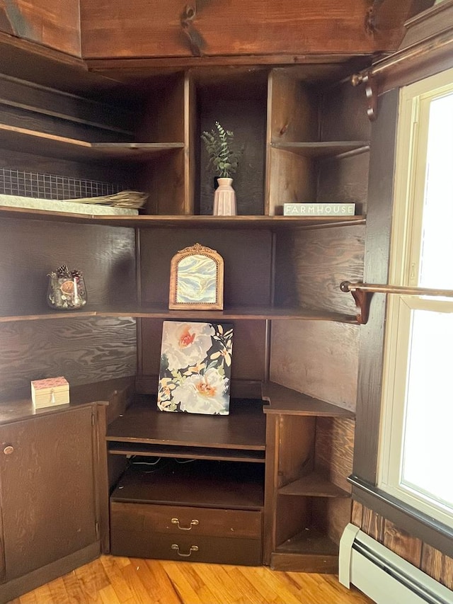 interior space with hardwood / wood-style floors and a baseboard radiator