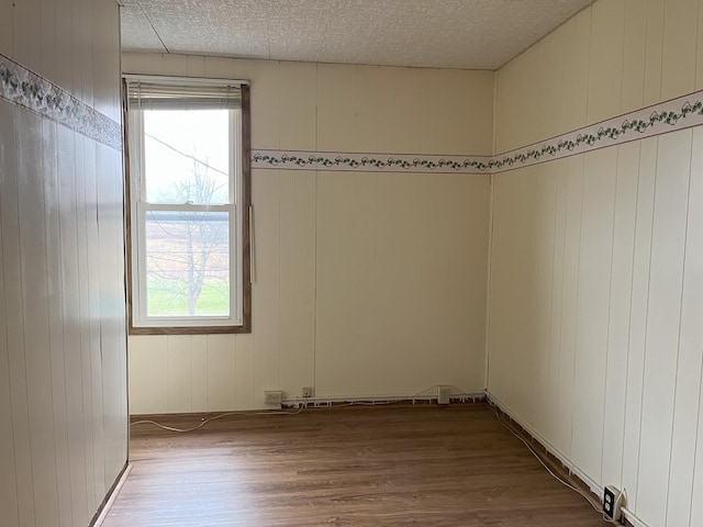 empty room featuring wood-type flooring