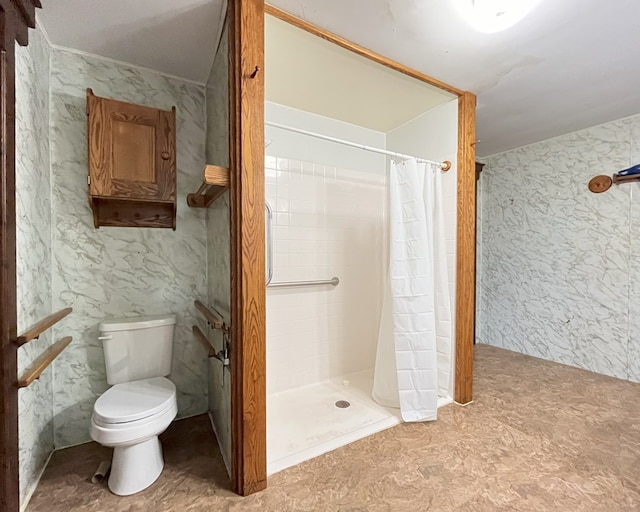 bathroom with toilet and walk in shower