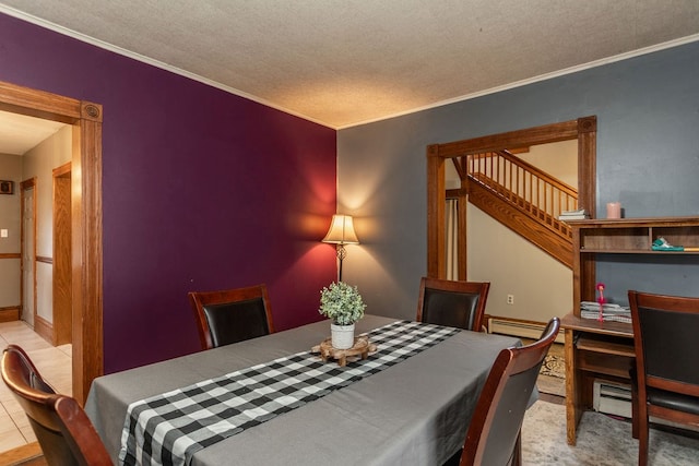 11 Purple St, Wellsboro, PA 16901 - dining area with stairway, baseboards, a textured ceiling, crown molding, and baseboard heating