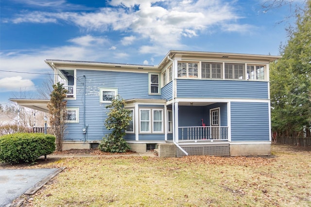 11 Purple St, Wellsboro, PA 16901 - back of property with a porch, a lawn, and a sunroom