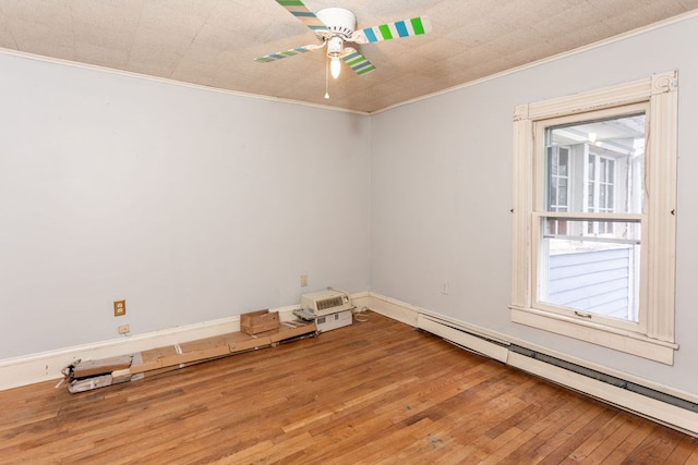 11 Purple St, Wellsboro, PA 16901 - unfurnished room with baseboard heating, crown molding, ceiling fan, and hardwood / wood-style floors
