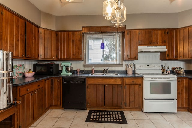 11 Purple St, Wellsboro, PA 16901 - kitchen with black appliances, dark countertops, under cabinet range hood, and a sink