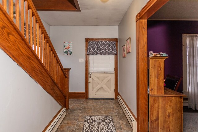 11 Purple St, Wellsboro, PA 16901 - entrance foyer featuring stone finish flooring, a baseboard heating unit, baseboards, stairway, and baseboard heating