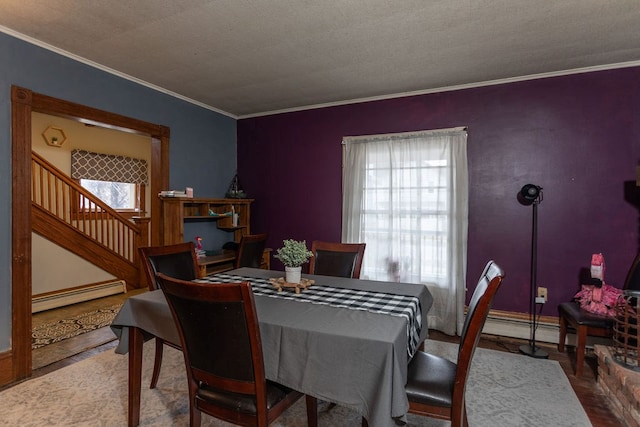 11 Purple St, Wellsboro, PA 16901 - dining area featuring stairs, crown molding, and a baseboard radiator