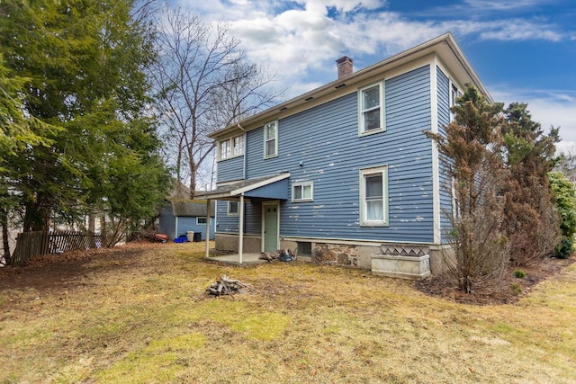 11 Purple St, Wellsboro, PA 16901 - back of property with a yard, fence, and a chimney