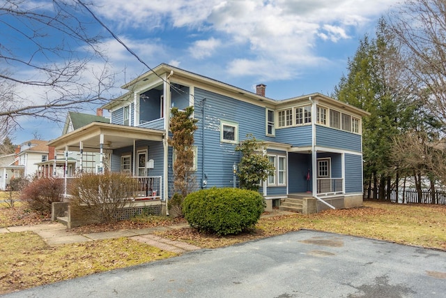11 Purple St, Wellsboro, PA 16901 - view of front of property with a porch, a chimney, and fence