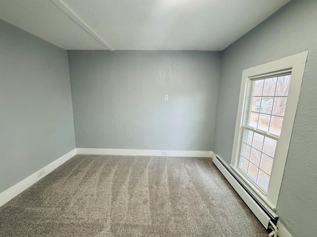 unfurnished room with carpet floors, baseboard heating, and baseboards