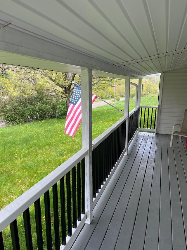 deck featuring a lawn