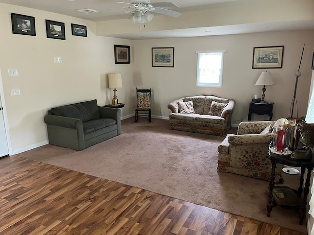 living room with hardwood / wood-style flooring and ceiling fan