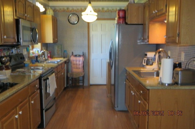 177 Old Barton Rd, Barton, NY 13734 - kitchen featuring appliances with stainless steel finishes, a sink, and brown cabinets