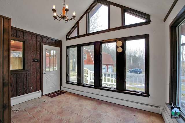 tiled foyer entrance featuring high vaulted ceiling, a baseboard heating unit, and an inviting chandelier