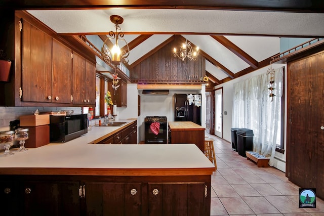 kitchen featuring pendant lighting, sink, a notable chandelier, black appliances, and kitchen peninsula