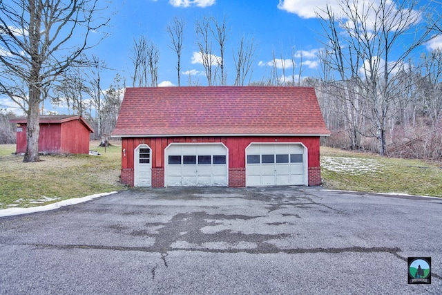 garage featuring a yard