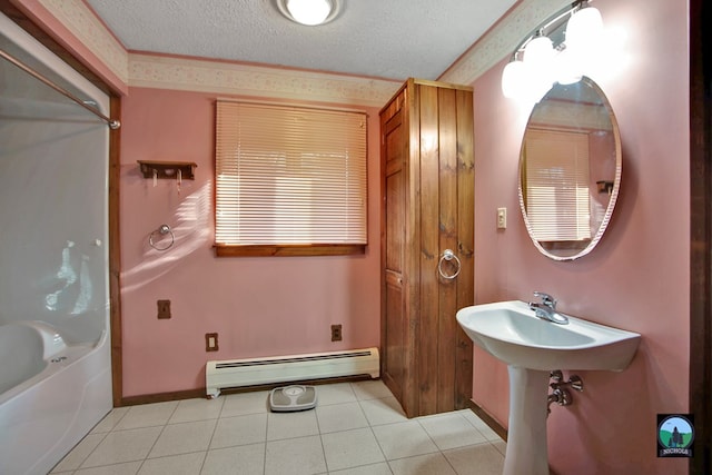 bathroom featuring a baseboard radiator, tile patterned floors, and a textured ceiling