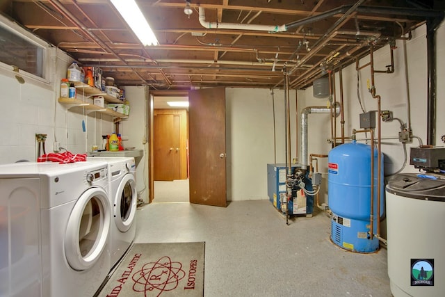 clothes washing area featuring independent washer and dryer