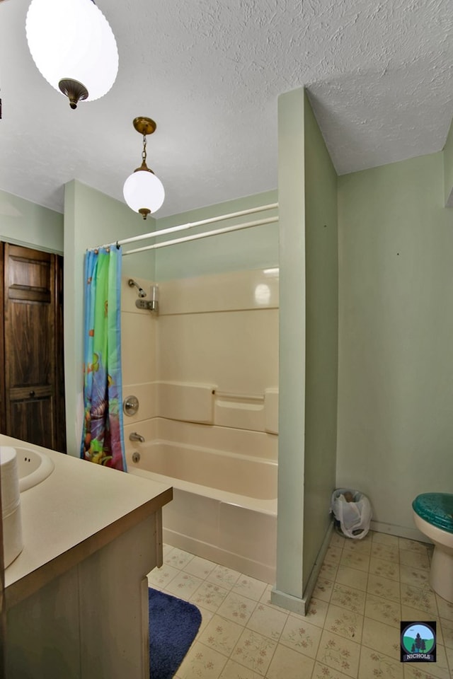 full bathroom featuring vanity, toilet, shower / tub combo, and a textured ceiling