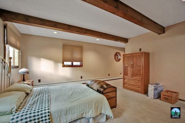 carpeted bedroom featuring beam ceiling and a textured ceiling