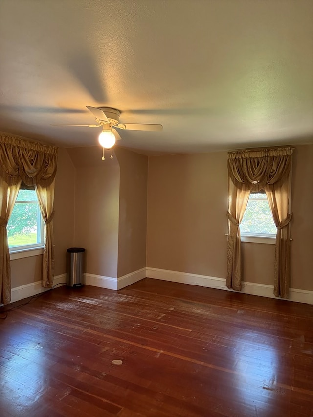 922 W Lockhart St, Sayre, PA 18840 - empty room with plenty of natural light, ceiling fan, and hardwood / wood-style flooring