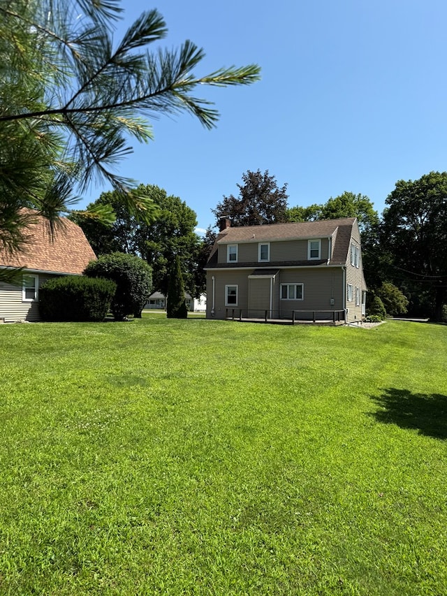 922 W Lockhart St, Sayre, PA 18840 - rear view of house with a yard and a chimney