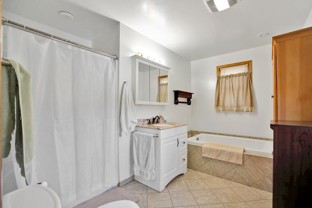 full bath with curtained shower, tile patterned flooring, toilet, vanity, and tiled tub