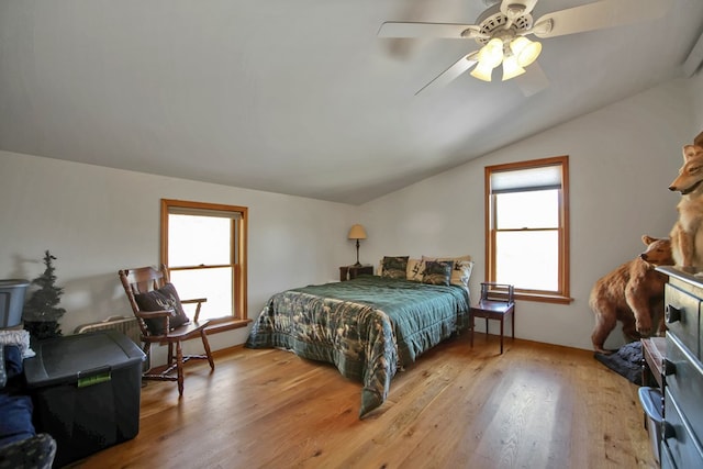 bedroom with lofted ceiling, ceiling fan, and wood finished floors