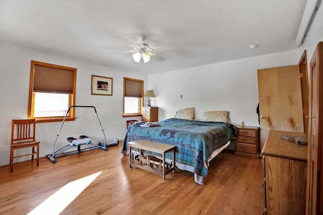 bedroom featuring ceiling fan and light wood finished floors