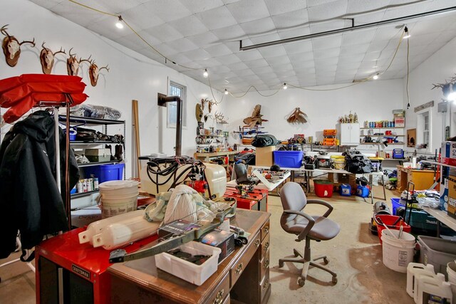 interior space featuring concrete flooring and a workshop area