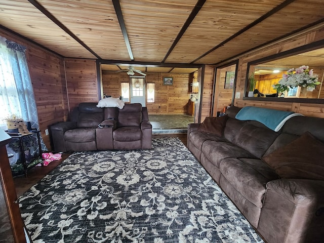 living room with wooden walls, ceiling fan, and wooden ceiling